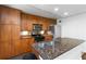 Charming kitchen featuring granite counters, stainless steel appliances, and wood cabinetry at 3046 Briarcliff Ne Rd # 7, Atlanta, GA 30329