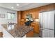 Modern kitchen showcasing wood cabinets, granite countertops, and stainless steel appliances at 3046 Briarcliff Ne Rd # 7, Atlanta, GA 30329