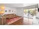 Bright living room with hardwood floors, modern furniture, and sliding glass doors to a balcony at 3046 Briarcliff Ne Rd # 7, Atlanta, GA 30329