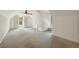 Large attic area with dormers, neutral carpeting, and ceiling fan at 9075 Preston Ln, Suwanee, GA 30024