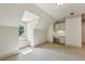 Lofted attic area with built-in desk and storage, carpeted floors, and a window seat at 9075 Preston Ln, Suwanee, GA 30024