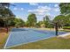 Community basketball court in a neighborhood with adjustable hoops and nets ready for a friendly game at 9075 Preston Ln, Suwanee, GA 30024