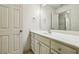 Bright bathroom featuring a vanity with a large mirror and plenty of cabinet space at 9075 Preston Ln, Suwanee, GA 30024