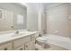 Bathroom featuring single vanity, toilet, tile floors, and a shower/tub combination at 9075 Preston Ln, Suwanee, GA 30024