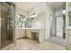 Bathroom featuring tile flooring, double sink vanity, shower with glass door, and large mirror at 9075 Preston Ln, Suwanee, GA 30024