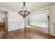 Formal dining area with elegant trim, hardwood floors, and an open layout at 9075 Preston Ln, Suwanee, GA 30024