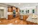 Well-appointed kitchen featuring stainless steel appliances, granite countertops, and tile backsplash at 9075 Preston Ln, Suwanee, GA 30024