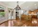 Charming kitchen view into the living area, hardwood floors and attractive features at 9075 Preston Ln, Suwanee, GA 30024