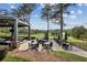 Picturesque outdoor patio area with tables and chairs overlooking the lush green golf course at 9075 Preston Ln, Suwanee, GA 30024