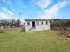 A grassy backyard with a home in the background at 1683 Candler Rd, Decatur, GA 30032