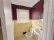 Cozy bathroom featuring yellow tile walls and classic fixtures at 1683 Candler Rd, Decatur, GA 30032