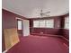 View of bedroom with red carpet and natural light at 1683 Candler Rd, Decatur, GA 30032