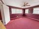 A view of a bedroom with red carpet at 1683 Candler Rd, Decatur, GA 30032