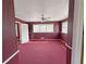 View of bedroom with red carpet and burgundy walls at 1683 Candler Rd, Decatur, GA 30032