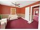 Living room with red walls and carpet at 1683 Candler Rd, Decatur, GA 30032