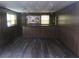 Basement with wood-style floors, bar, and wood paneling at 4141 Fredericksburg Dr, College Park, GA 30337