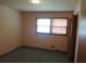 Bedroom featuring green carpet, peach colored walls and a double window at 4141 Fredericksburg Dr, College Park, GA 30337