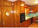 The kitchen has a classic layout, wooden cabinets and appliances at 4141 Fredericksburg Dr, College Park, GA 30337
