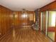 Laminate floors throughout living room with brick fireplace and natural lighting from sliding door at 4141 Fredericksburg Dr, College Park, GA 30337