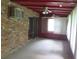 Enclosed sunroom featuring exposed brick, ceiling fans, and sliding glass door access to the exterior at 4141 Fredericksburg Dr, College Park, GA 30337