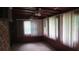 Enclosed sunroom featuring large windows with blinds and ceiling fans at 4141 Fredericksburg Dr, College Park, GA 30337