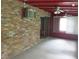 Enclosed sunroom featuring exposed brick, ceiling fans, and sliding glass door access to the exterior at 4141 Fredericksburg Dr, College Park, GA 30337