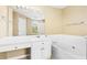 Bright bathroom featuring double sink vanity, soaking tub, and a large window at 1016 Borrington Ln, Stockbridge, GA 30281