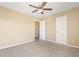 Neutral bedroom with carpet, ceiling fan, and closet with natural light at 1016 Borrington Ln, Stockbridge, GA 30281