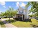 Charming two-story home with stone accents, landscaped front yard, and a sidewalk at 1016 Borrington Ln, Stockbridge, GA 30281