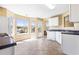 Bright eat-in kitchen with white cabinets, ample counter space, and a view of the backyard at 1016 Borrington Ln, Stockbridge, GA 30281