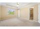 Bright main bedroom featuring tray ceiling and walk-in closet at 1016 Borrington Ln, Stockbridge, GA 30281