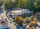 Aerial view featuring a busy shopping center with beautiful fall colored trees at 1016 Wildwood Ne Rd, Atlanta, GA 30306