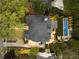 Aerial view showcasing the roof and backyard with a pool, patio, and landscaped yard at 1016 Wildwood Ne Rd, Atlanta, GA 30306
