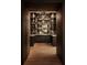 Beautiful bar area with open shelving, great storage and an elegant chandelier at 1016 Wildwood Ne Rd, Atlanta, GA 30306