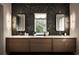 Stylish bathroom with dual sinks, marble countertops, decorative lighting, and a patterned accent wall at 1016 Wildwood Ne Rd, Atlanta, GA 30306