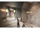 Contemporary bathroom featuring a gray tiled walk-in shower and a marble top vanity at 1016 Wildwood Ne Rd, Atlanta, GA 30306