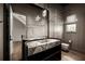 Powder room with modern vanity, custom mirror, and unique lighting at 1016 Wildwood Ne Rd, Atlanta, GA 30306