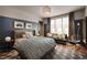 Comfortable bedroom with blue and white color scheme, stylish decor, and ample natural light at 1016 Wildwood Ne Rd, Atlanta, GA 30306