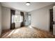 Bright bedroom with hardwood floors, a large window, neutral paint and an adjoining bathroom and closet at 1016 Wildwood Ne Rd, Atlanta, GA 30306