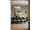 Elegant dining room featuring modern decor, stylish lighting, and seating for ten, perfect for hosting dinner parties at 1016 Wildwood Ne Rd, Atlanta, GA 30306