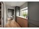 Dressing room area featuring custom cabinetry, a window with sheer curtains, and a view to an adjoining sitting area at 1016 Wildwood Ne Rd, Atlanta, GA 30306