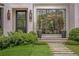 Charming front entrance with a well manicured lawn and stone path leading up to the front door at 1016 Wildwood Ne Rd, Atlanta, GA 30306