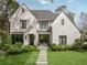 Stunning white brick home with modern black framed windows and professionally landscaped front yard at 1016 Wildwood Ne Rd, Atlanta, GA 30306
