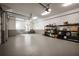 Spacious three car garage with epoxy floor, shelving and ample storage for organization at 1016 Wildwood Ne Rd, Atlanta, GA 30306