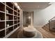 Hallway with hardwood floors, a large bookcase, and a glass door to another room at 1016 Wildwood Ne Rd, Atlanta, GA 30306