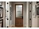 View of a hallway with a door to 'The Laboratory' and black and white artwork adorning the walls at 1016 Wildwood Ne Rd, Atlanta, GA 30306