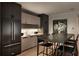 Kitchen features sleek black appliances, light wood cabinets, and a stylish dining area at 1016 Wildwood Ne Rd, Atlanta, GA 30306