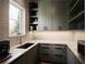 Butler's pantry with shaker cabinets, stone counters, and stainless appliances at 1016 Wildwood Ne Rd, Atlanta, GA 30306