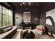 Sophisticated living area with unique lighting, refined seating, and views of the outdoors, exuding modern elegance at 1016 Wildwood Ne Rd, Atlanta, GA 30306