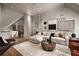 Spacious living room with neutral colors, a sectional sofa, and a modern decorative fireplace at 1016 Wildwood Ne Rd, Atlanta, GA 30306